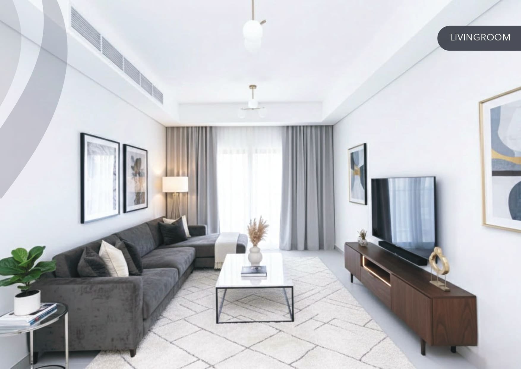 Contemporary living room interior showcasing a large grey sectional sofa, a white coffee table, and a modern TV console.