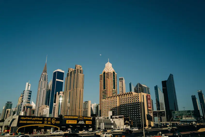 A panoramic view of Dubai's skyline, featuring modern skyscrapers and busy streets. This image can be used to highlight the diverse range of properties available in the UAE, including budget-friendly options.