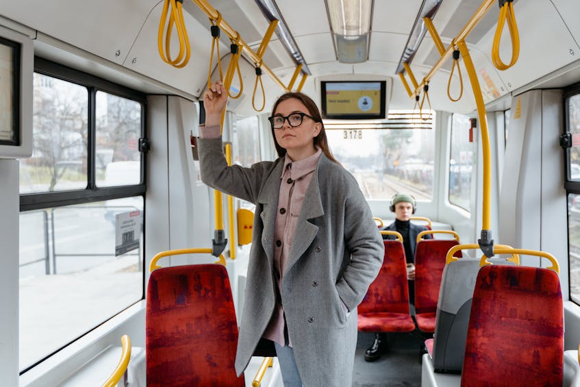 a girl standing in bus to get china mall ajman uae 