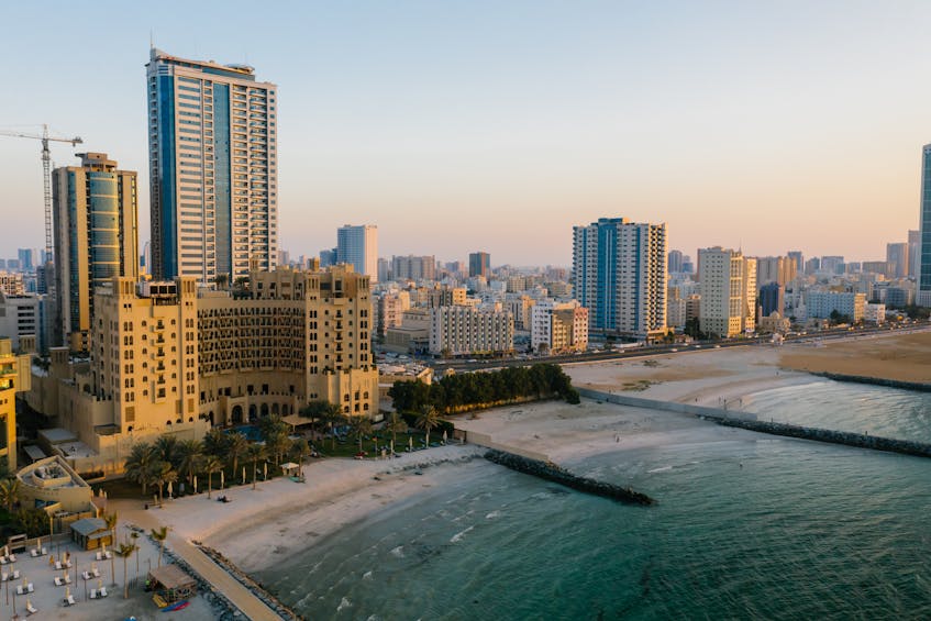 Ajman building on beach, showcasing ARRA's role in regulating the real estate market in Ajman