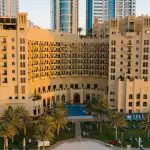 A stunning view of a residential building in Ajman, showcasing the city’s thriving real estate market and architectural charm, reflecting compliance with Ajman real estate laws.