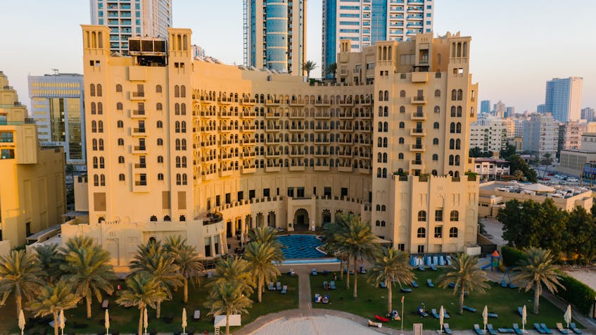 A stunning view of a residential building in Ajman, showcasing the city’s thriving real estate market and architectural charm, reflecting compliance with Ajman real estate laws.