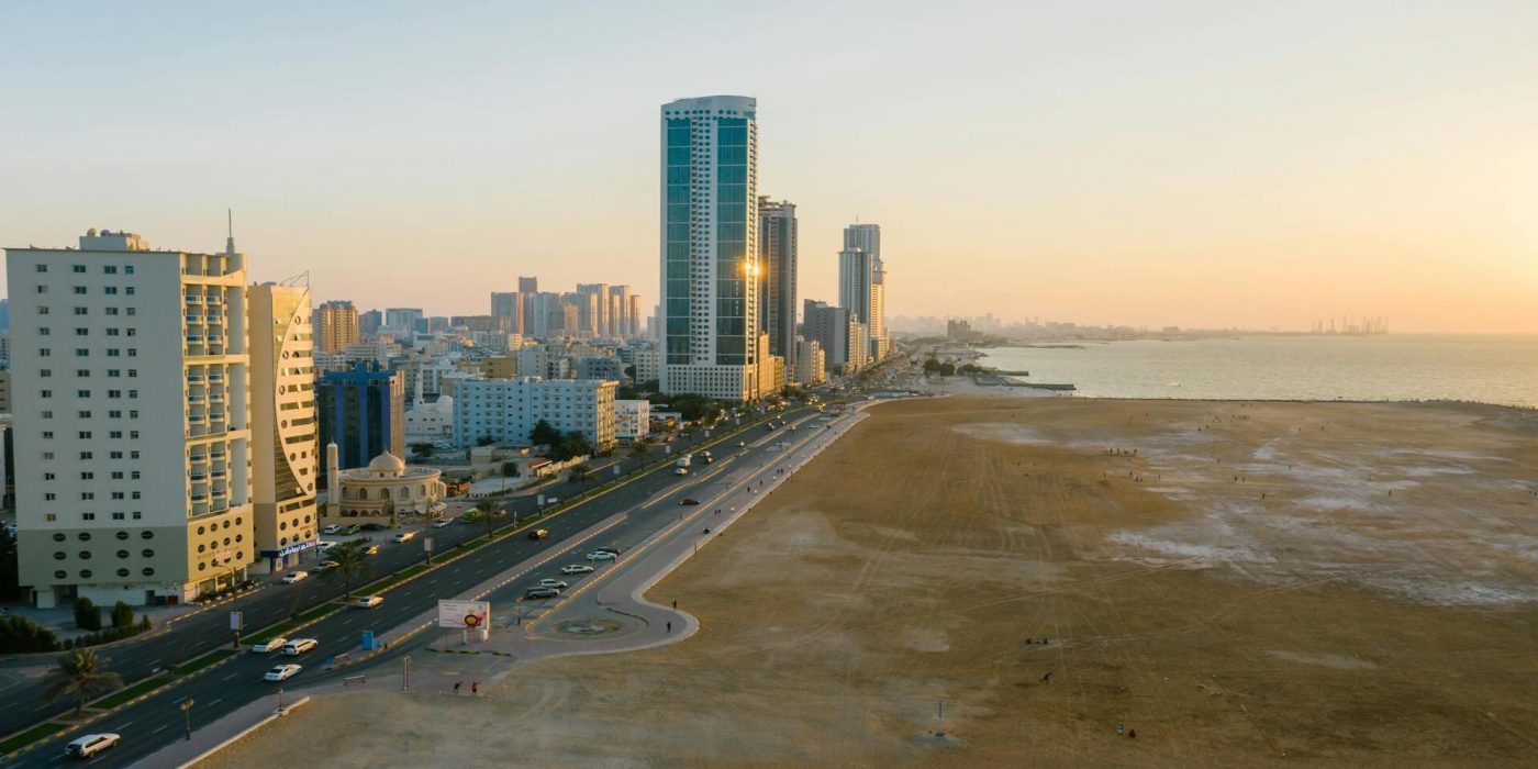 a view of ajman corniche and sorrounding buildings