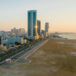 a view of ajman corniche and sorrounding buildings