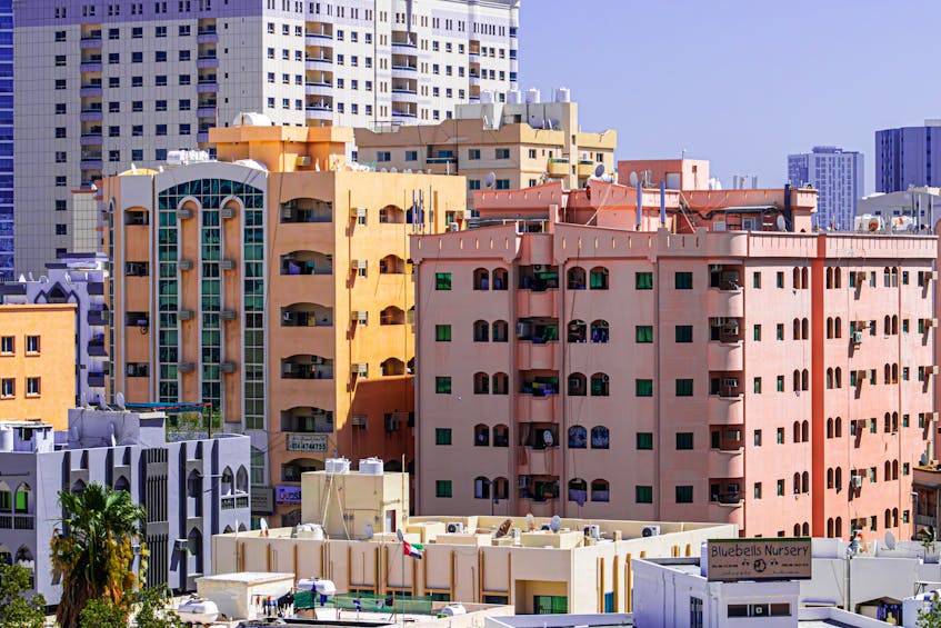 Skyline view of rent-to-own apartments in Ajman, showcasing modern residential buildings in a growing real estate market. Ideal for buyers looking for flexible homeownership options.