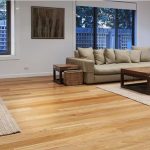 the wooden floor in the lounge of an apartment is affordable flooring solution to make the space elegant