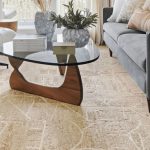 Modern beige textured carpet in a Dubai living room with contemporary furniture and glass coffee table