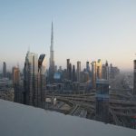 a dubai skyline with tall buildings represent affordable and luxury housing in dubai